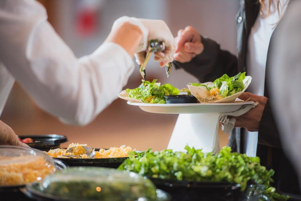 Tower7 Catering serving fresh ingredients at a private event.