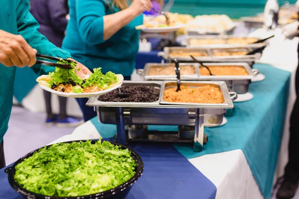 Event goers self serving from Tower7 Catering trays.